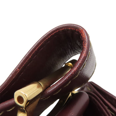 カルティエ Cartier マストライン ボルドー レザー ショルダーバッグ ゴールド金具 巾着 赤