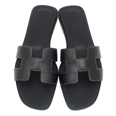 エルメス HERMES オラン H021056Z ブラック ボックスカーフ レザー #38 1/2 サンダル 新品 未使用 H型 黒 白ステッチ フラットサンダル