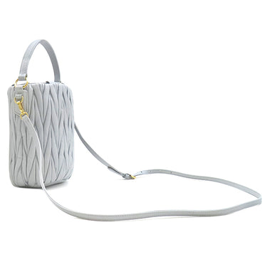 ミュウミュウ MIU MIU マテラッセ バケットバッグ 5BE085 コーンフラワー レザー 2WAYバッグ ゴールド金具 ブルーグレー キルティング 巾着