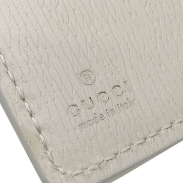 グッチ GUCCI メタル ロゴ 772640 グレー レザー 二つ折り財布 ゴールド金具