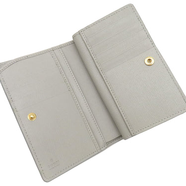 グッチ GUCCI メタル ロゴ 772640 グレー レザー 二つ折り財布 ゴールド金具