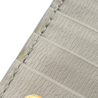 グッチ GUCCI メタル ロゴ 772640 グレー レザー 二つ折り財布 ゴールド金具